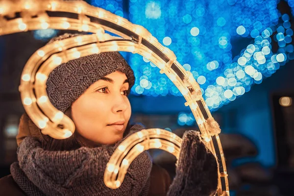 Dreamy woman with christmas lights — Stock Photo, Image