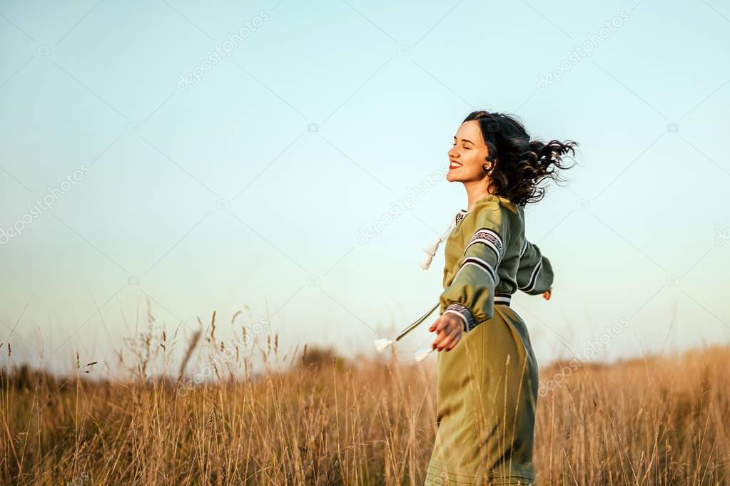 brunette girl in the field 