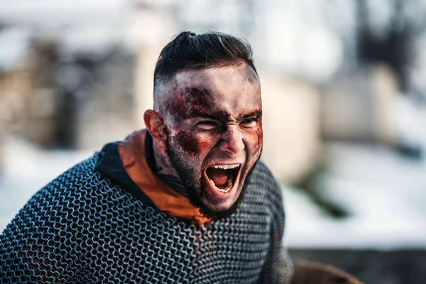 The evil emotions of a young warrior who goes to battle with the — Stock Photo, Image