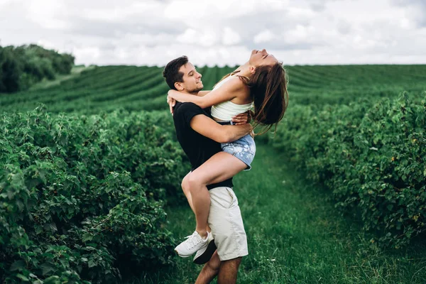 Tender Loving Couple Walking Field Currant Man Whirls Woman Her — Stock Photo, Image