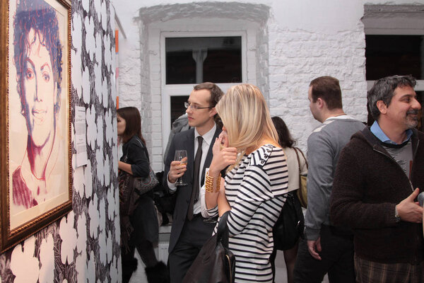 People view the painting by artist Andy Warhol, Michael Jackson,