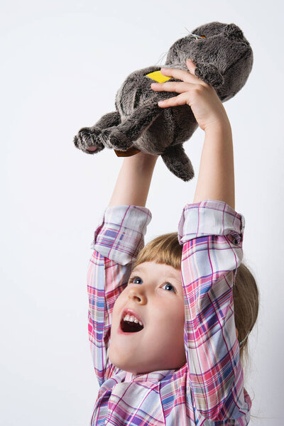 girl playing with soft toy
