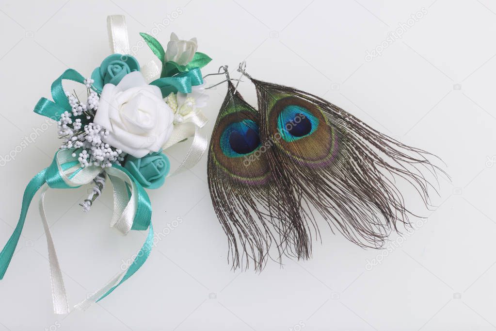 Wedding boutonniere and earrings. On a white background.