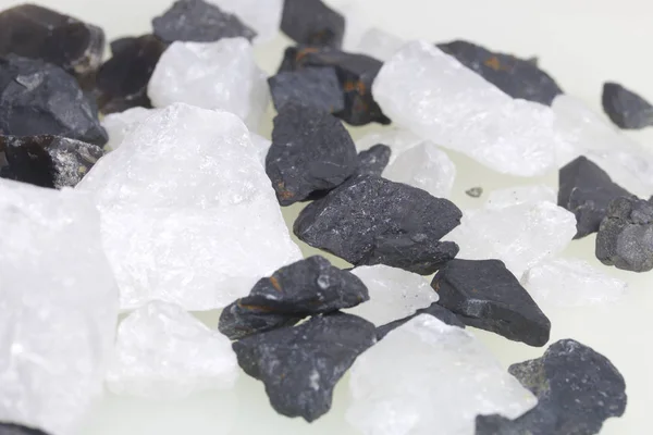 Stones for household cleaning and mineralization of water. The crystals are black and white.