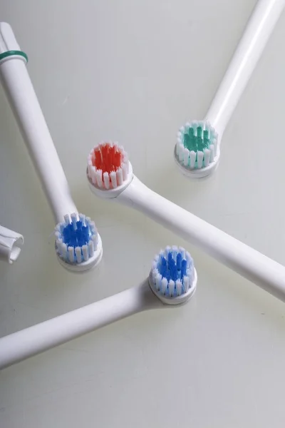 Nozzles for electric toothbrush. On a white background. — Stock Photo, Image