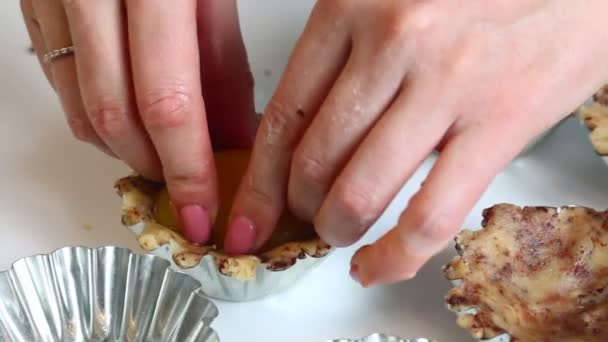 Woman Puts Peaches Filling Dough Batter Filled Metal Molds Baking — Stock Video