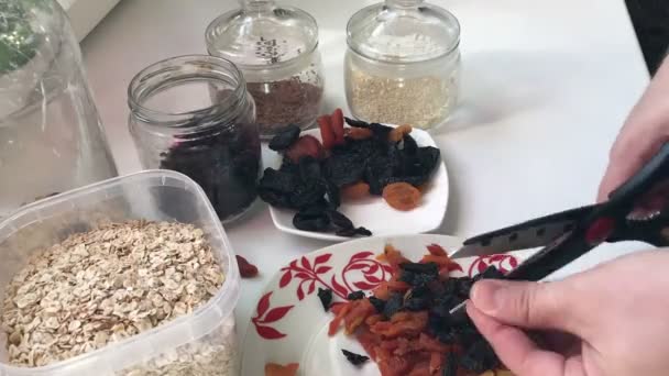 Man Preparing Mixture Muesli She Cuts Dried Fruit Scissors Mixes — Stock Video