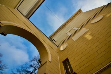 Elements of urban architecture. Fragments of buildings against the blue sky.