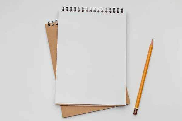 Two notebooks lying on a white table — Stock Photo, Image