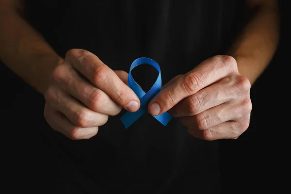 prostate cancer ribbon, colon cancer concept, blue ribbon