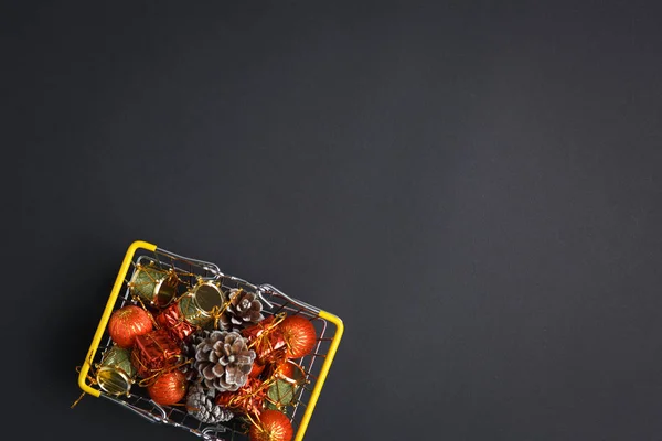 Basket with gifts, deer, stars and fir-trees, flat lay on a dark — Stock Photo, Image