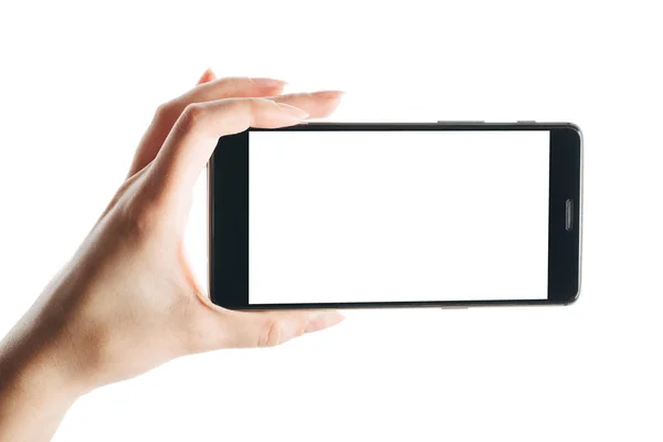 Ręka trzyma smartfon odizolowany na białym — Zdjęcie stockowe