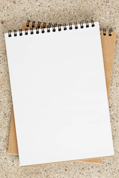 open notebook on the table, with blank page