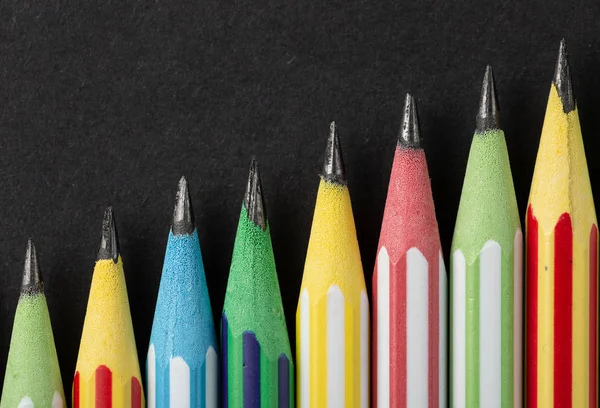Colored pencils on gray background in macro — Stock Photo, Image