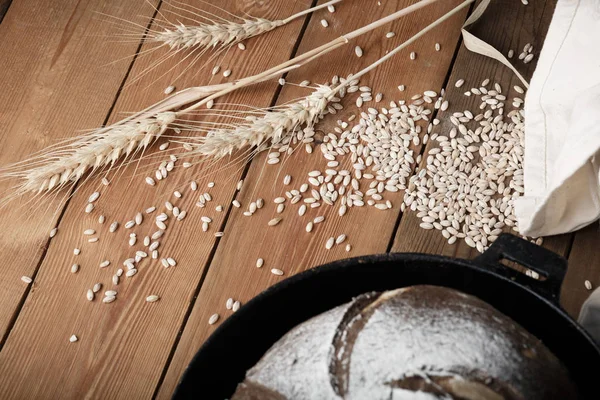 Homemade bread with flour and grain — Stock Photo, Image