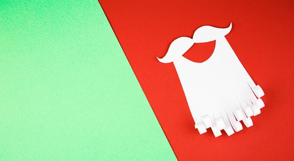 paper beard on red and green background