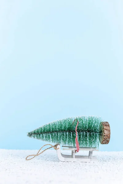 Toy tree on sled. new year composition — Stock Photo, Image