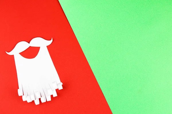 paper beard on red and green background