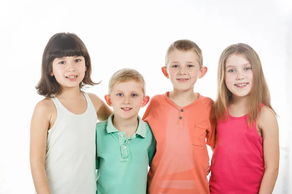 Group of children stand hugging each other — Stock Photo, Image