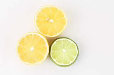 Fresh slices of orange lime on a white background.