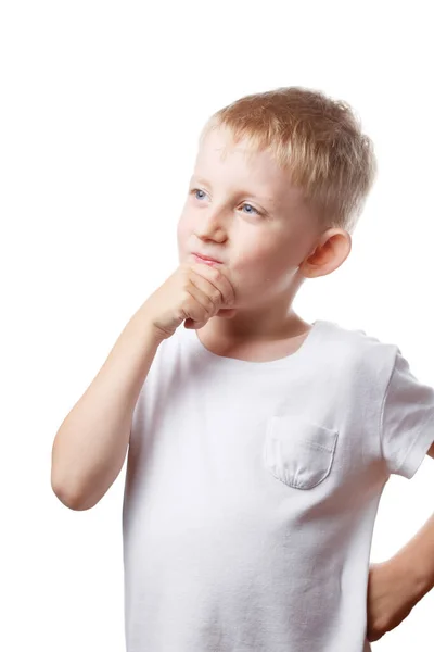 Kleine jongen denkt na over de taak — Stockfoto