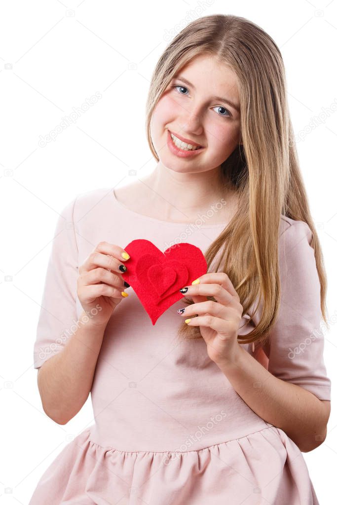 girl with red heart in hands on white background.