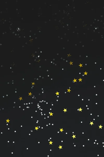 Estrellas sobre un fondo de papel negro — Foto de Stock