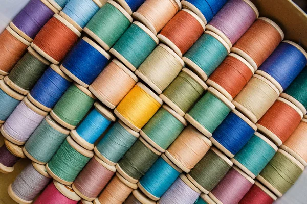 Rolls of colorful threads, close-up and top view. — Stock Photo, Image