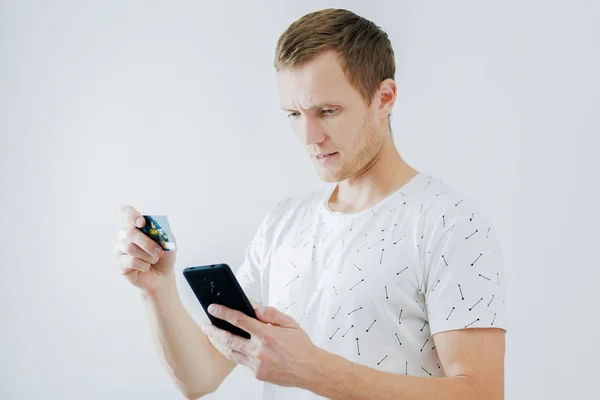 Man with phone in hands, on white background — 스톡 사진