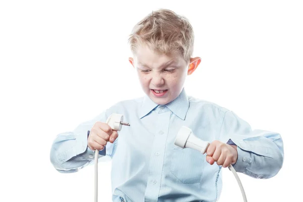 Boy with an electric plug in his hands — Stock Photo, Image