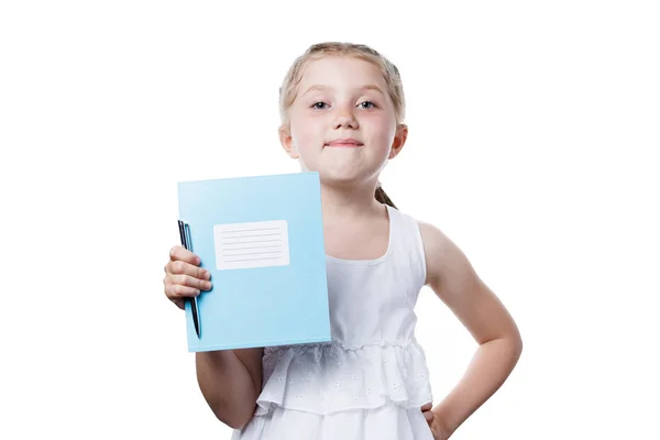 Schoolgirl holding notebook in hands — Zdjęcie stockowe