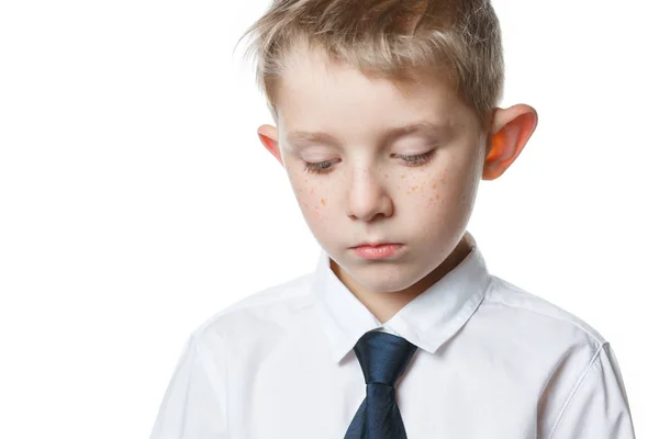Sad boy on isolated background schoolar in uniform — Stock Photo, Image
