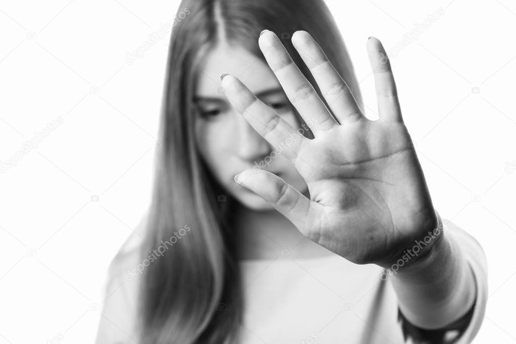 cute girl showing hand stop sign.black and white.