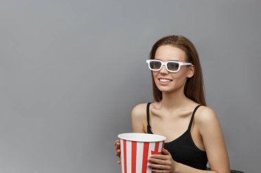 Attractive woman in white 3D glasses 