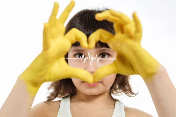 Little girl paint heart with hands — Stock Fotó