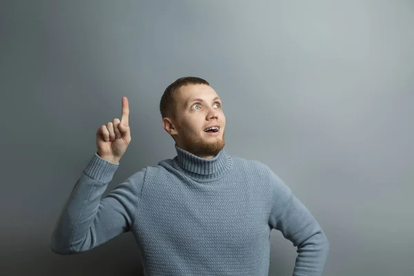 Handsome man shows thumb up in surprise — Stockfoto