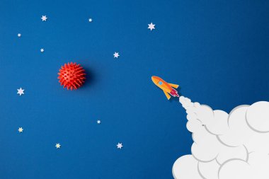Astronot, yıldız ve roket ile mavi arkaplan
