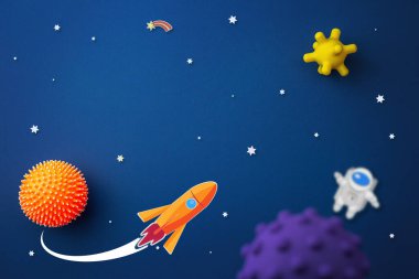 Astronot, yıldız ve roket ile mavi arkaplan