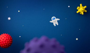 Astronot, yıldız ve roket ile mavi arkaplan