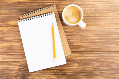 Kalem ve kahve fincanlı defter..