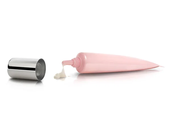 Tube cream. The cream is squeezed from a tube on a white background