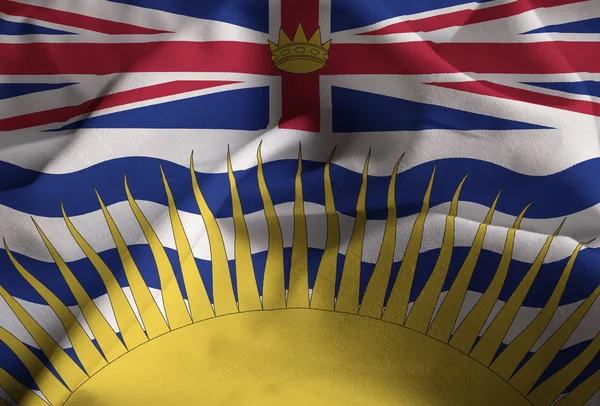 Primer plano de la bandera de la Columbia Británica con volantes, bandera de la Columbia Británica soplando en el viento — Foto de Stock