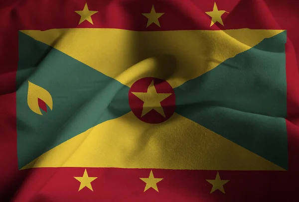 Close-up van gegolfde Grenada vlag, Grenada vlag waait in de Wind — Stockfoto