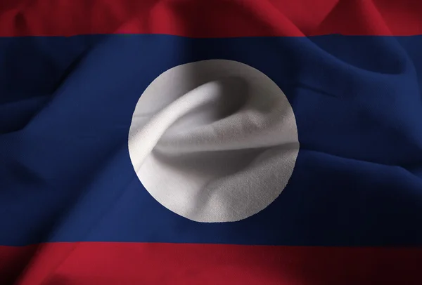 Närbild av ruggig Laos flagga, Laos flagga blåser i vinden — Stockfoto