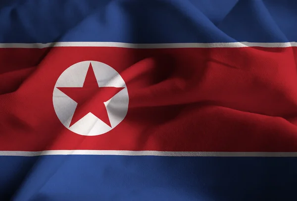 Primer plano de la bandera de Corea del Norte con volantes, bandera de Corea del Norte soplando en el viento — Foto de Stock