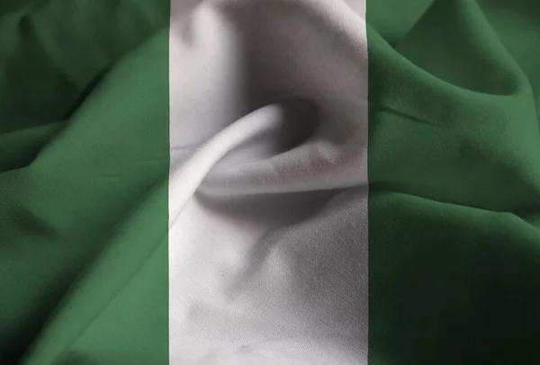 Крупним планом гофровані Нігерії прапор, Нігерія прапор дме вітер — стокове фото