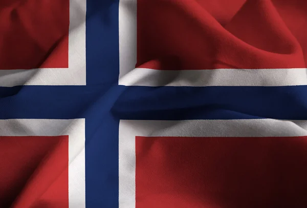 Närbild av ruggig Norge flagga, Norge flaggan blåser i vinden — Stockfoto