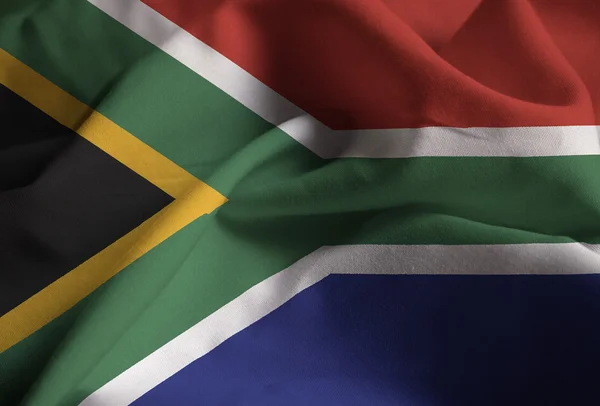 Primer plano de la bandera de Sudáfrica con volantes, bandera de Sudáfrica soplando en el viento — Foto de Stock