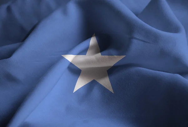 Closeup της σημαίας σημαία, Σομαλία αναστατωμένα Σομαλία πνέει στον άνεμο — Φωτογραφία Αρχείου