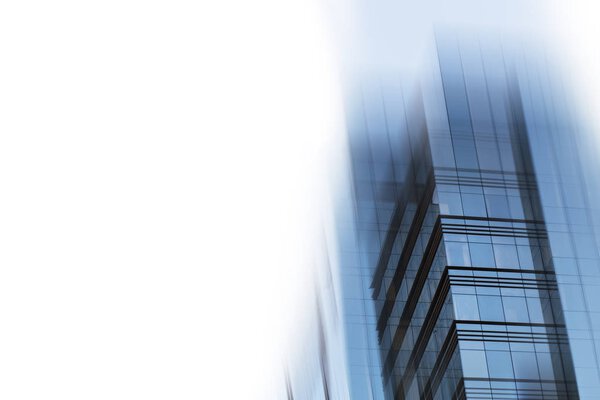 Abstract business modern city urban futuristic architecture background. Real estate concept, motion blur, reflection in glass of high rise skyscraper facade, toned blue picture with bokeh